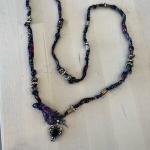 Fabric necklace with an assortment of jewels